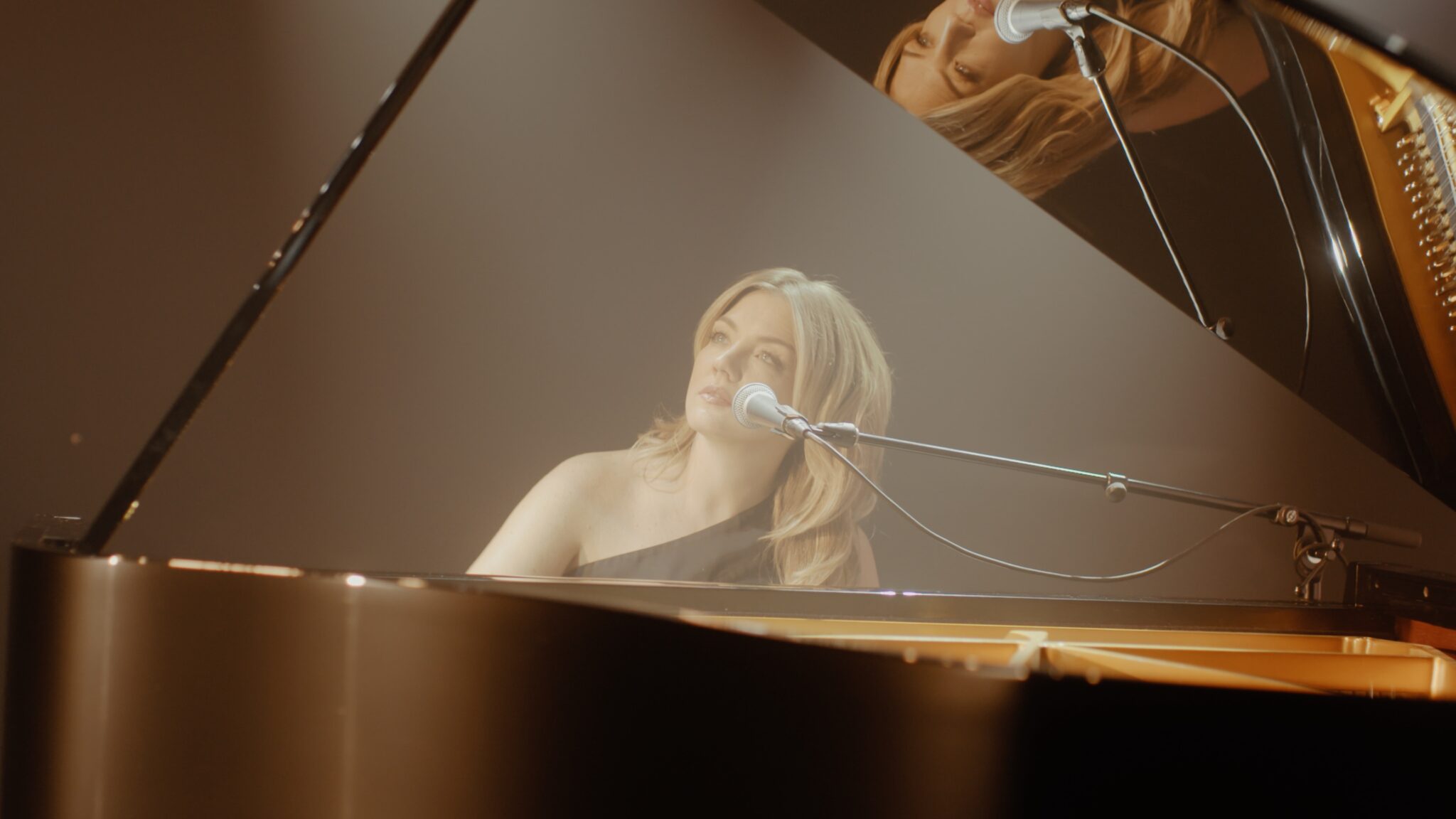 Annie Bonsignore sitting at a grand piano